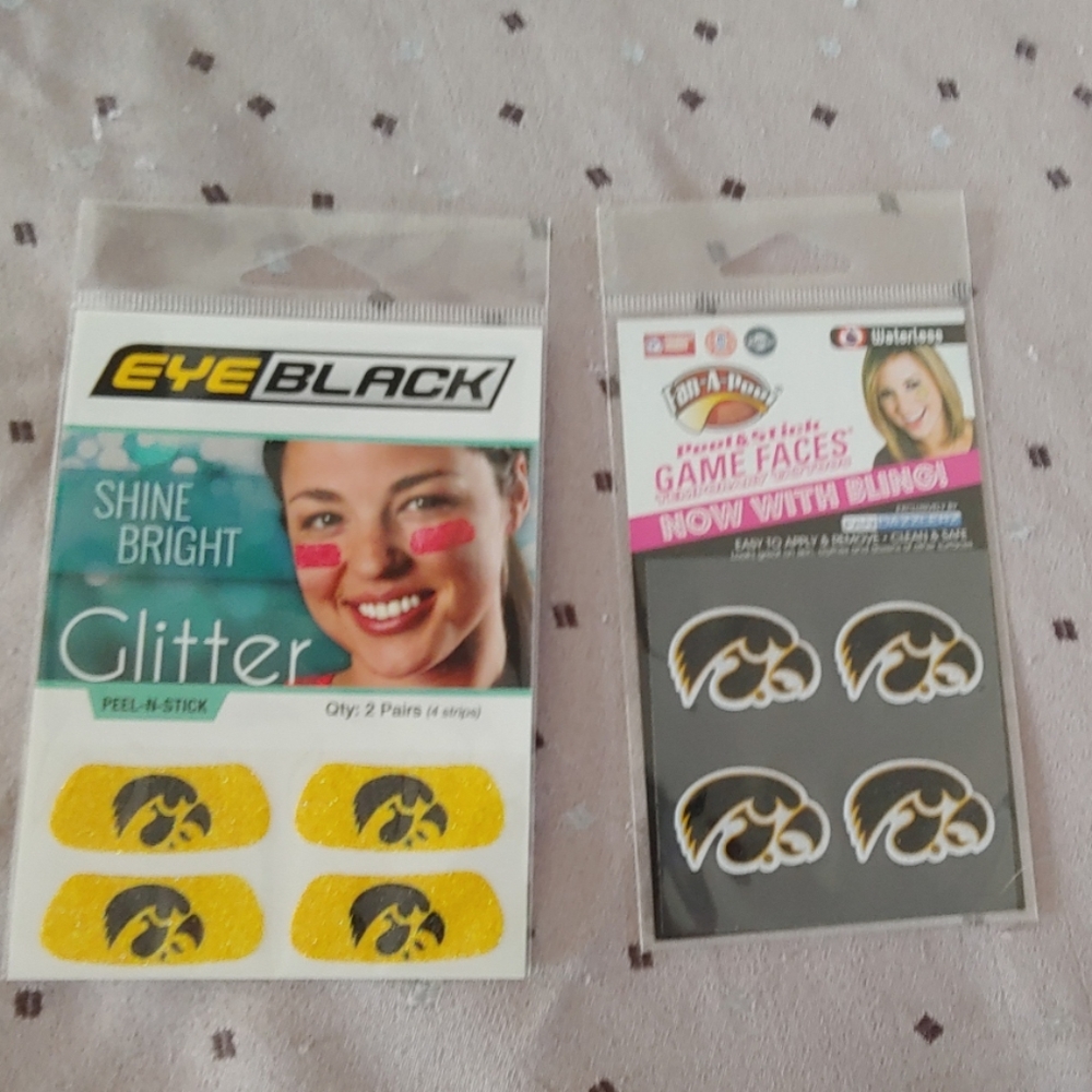 Eye glitter and temp tattoos.  Iowa Hawkeyes